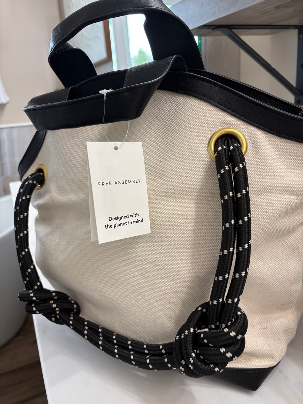 Free Assembly Cream Canvas Tote with Black Rope Handles and Gold Eyelets